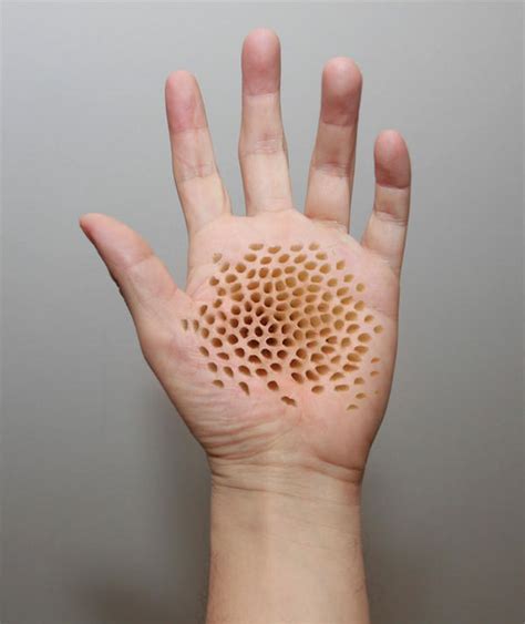 holeskin|hand with tiny holes.